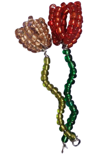 Two tulips made from beads and wire. The left tulip is pink
                            with a light green stem, and the one on the right is red with a dark green stem.